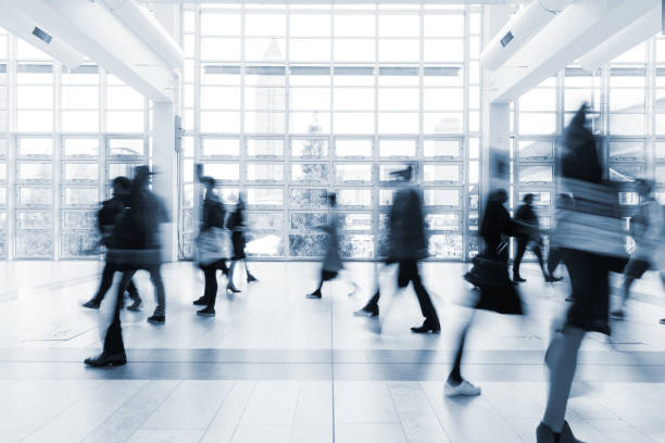 istock blurred people walking in Frankfurt building 892807544
