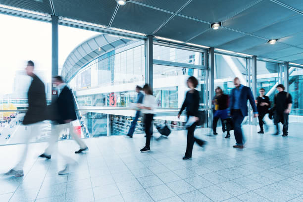 istock blurred people walking in Frankfurt building 892807574