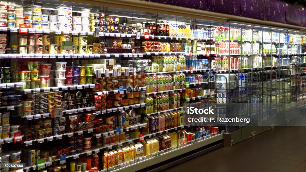 Large Dairy Section in Supermarket A large dairy section in supermarket. Supermarket Stock Photo