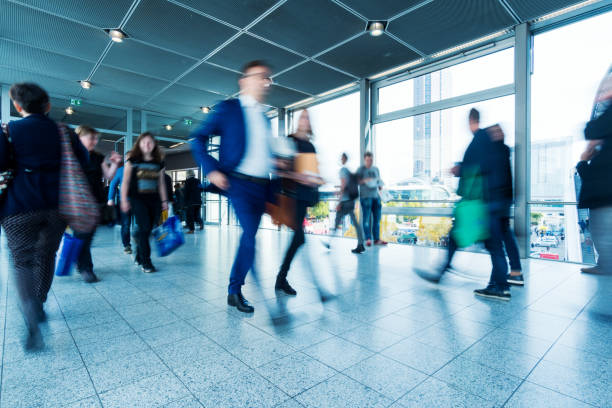 istock blurred people at Frankfurt trade fair 892807612