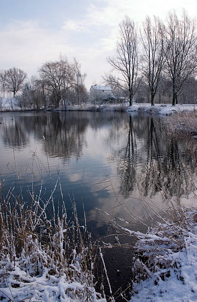istock Small house in Winter scene at lake 89280938