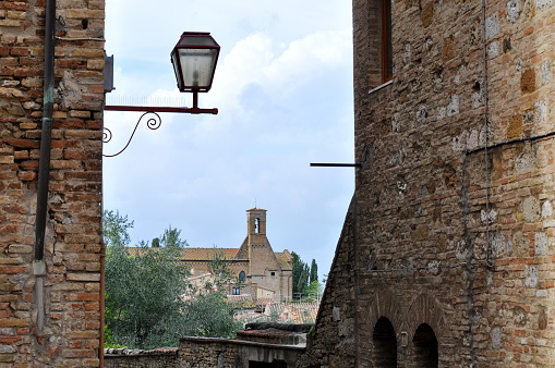 Stone and brick walls in the medival hill town of San Gimignano, Tuscany, Italy