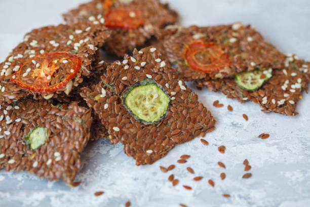 istock Crispy vegetable flax crispbread with sesame seeds and herbs. 892826628
