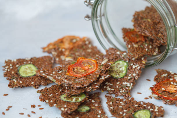 istock Crispy vegetable flax bread with sesame seeds and herbs. 892826656