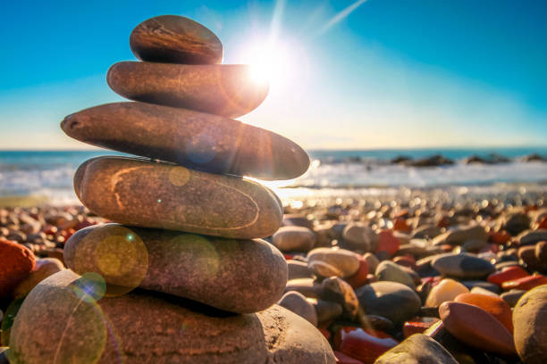 Pile of Feng Shui stones on rocky beach.