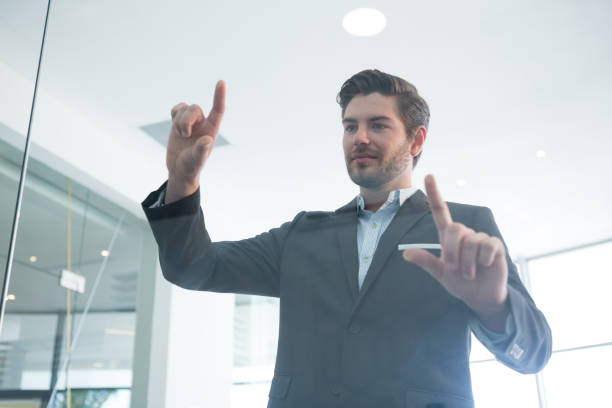 istock Businessman touching invisible digital screen 892827422