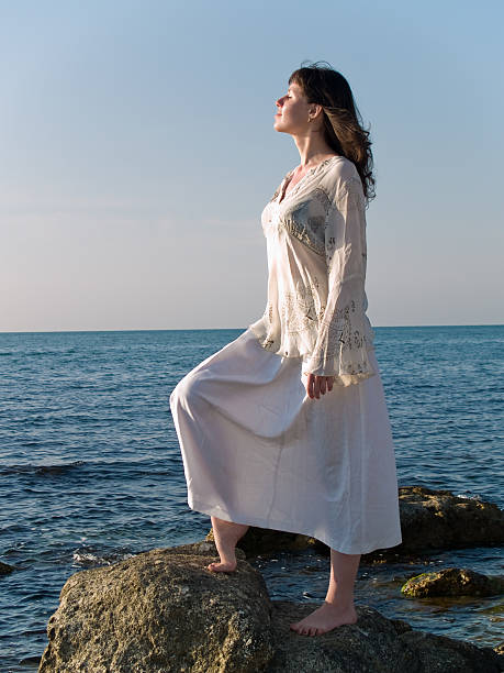 istock Young Woman on Sea Stone Looking Straight 89283080