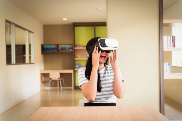 istock Young woman wearing virtual reality headset, Technology concept 892834564