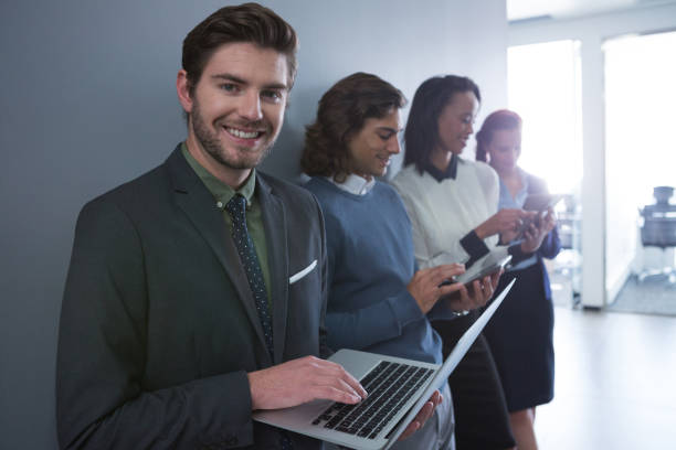 istock Team of business people using electronic devices 892834872