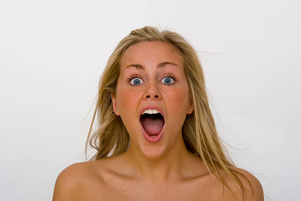 istock Beautiful Young Blond Woman Open Mouthed Shocked Shouting or Screaming 89283881