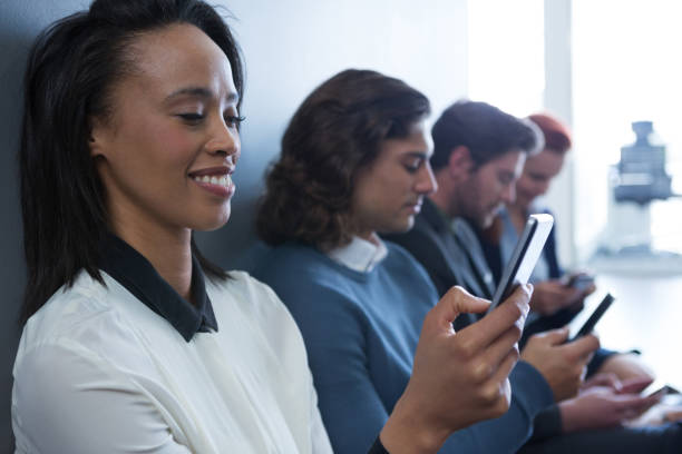 istock Team of business people using mobile phone 892841080