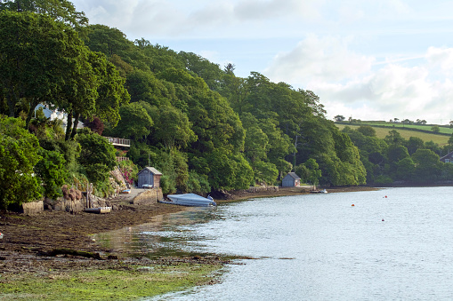 A peaceful summer morning on the Helford Estuary at old fashioned Port Navas, Cornwall, UK