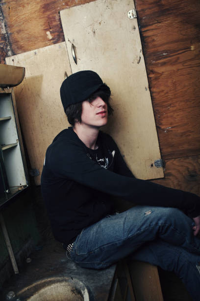 istock Teen Man with Black Hat in Abandoned Bathroom 89286087