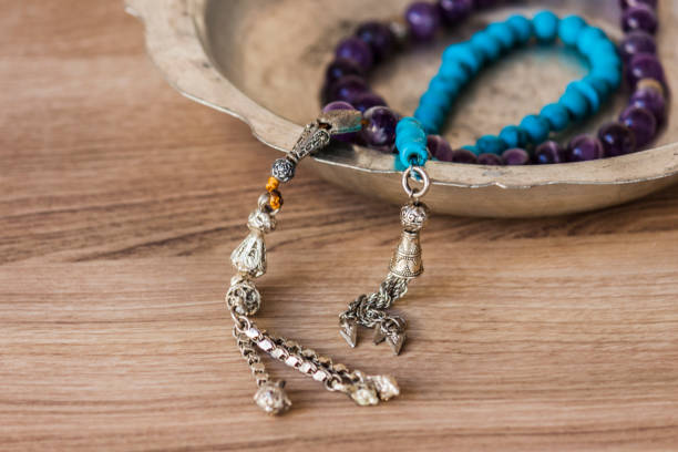 istock Muslim prayer beads necklaces on a zink pot 892865644