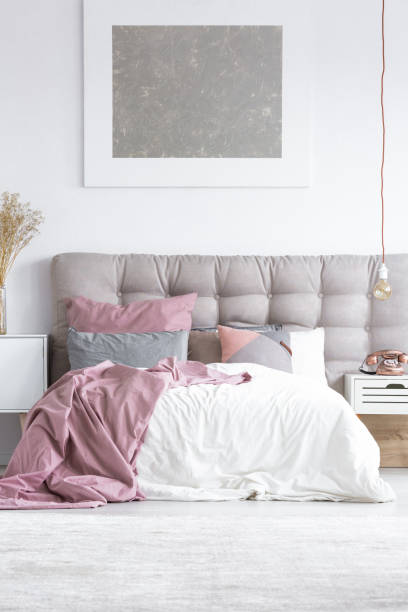istock Stylish hotel room with painting 892869132