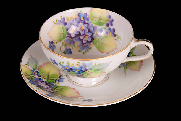 istock Violets on Antique cup & saucer w- clipping path 89287001
