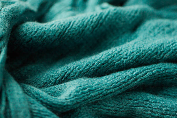 istock The texture of a cozy warm blue scarf 892872904
