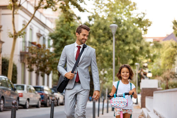 istock I love it when dad walks me to school 892876582