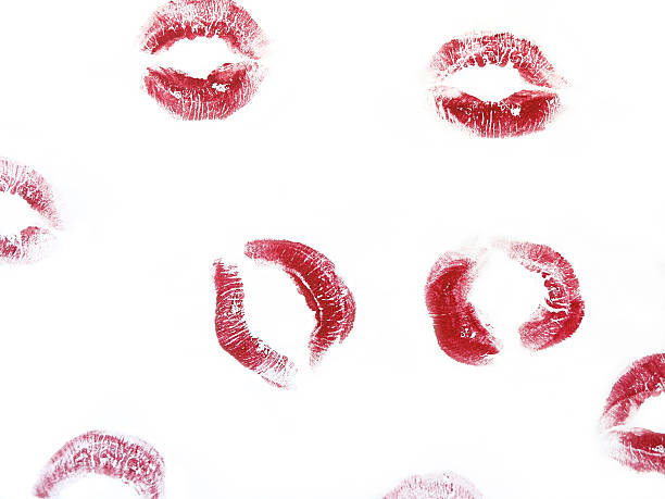 Random red kisses on a white background stock photo