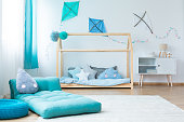 Blue child's bedroom with mattress