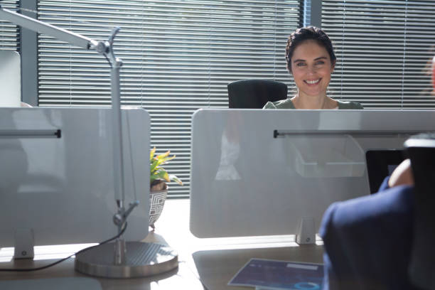 istock Beautiful female executive looking at camera 892893534