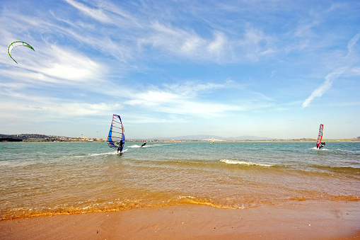 Tarifa, Spain. 3rd February, 2020. Many kitesurfers doing sports in the Atlantic ocean near the windy Bolonia beach
