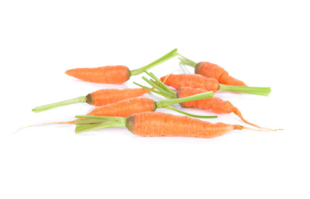 istock fresh baby carrot with stem on white background 892895278