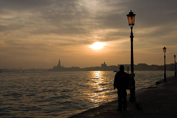 couple enjoying the view of the grand canal - venice
