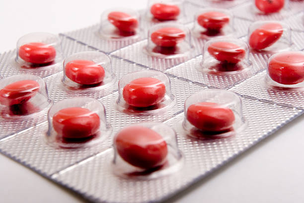 Little red pills stock photo