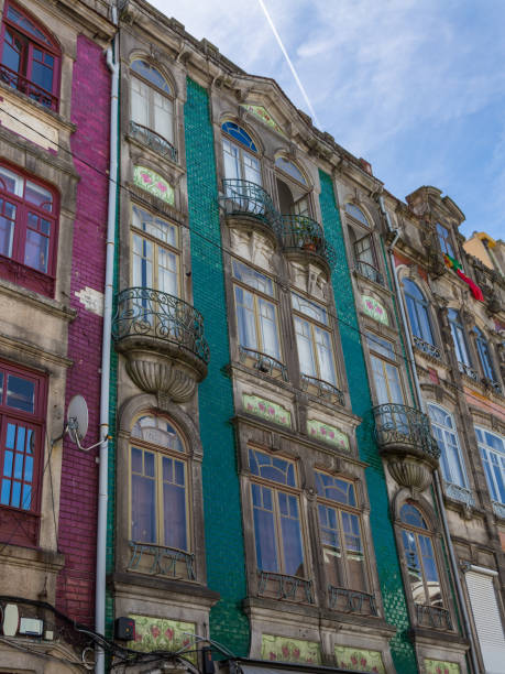 istock Typical Colorful Portuguese Architecture: Tile Azulejos Facade with Antique Windows And Balcony - Portugal 892904462