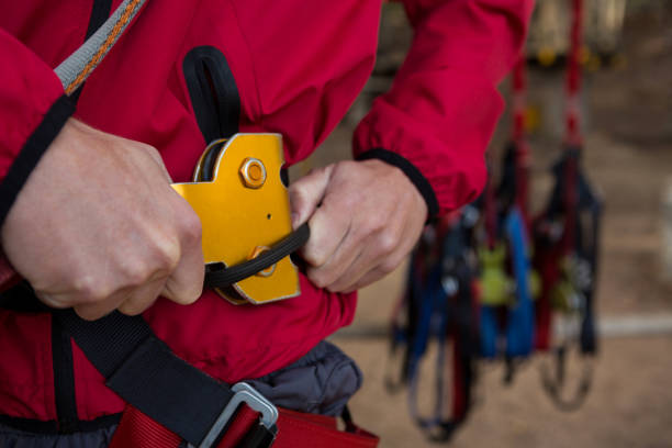 istock Hiker man adjusting his harness in the forest 892918998