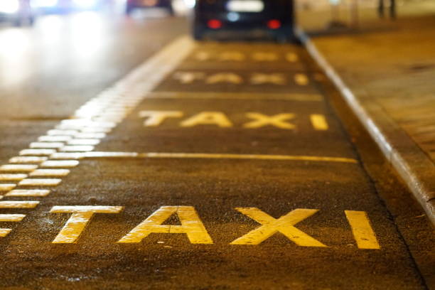 taxi sign on asphalt - pista de aeroporto imagens e fotografias de stock