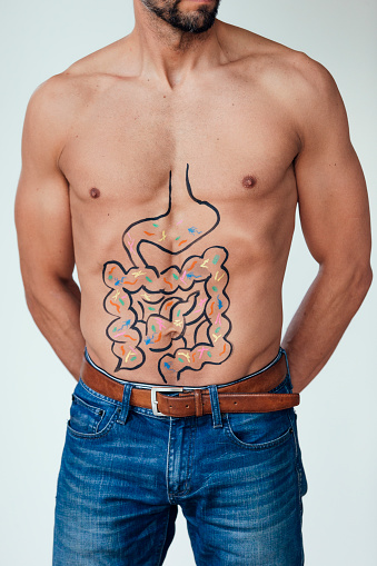 Image of a man with intestines drawn on his abdomen of good and bad bacteria