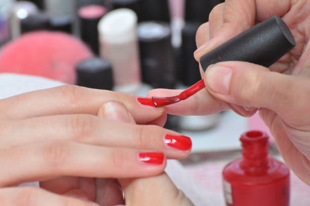 istock Women getting treatment at nail salon 892960752