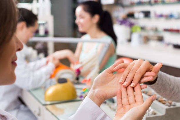 istock Closeup of  hands receiving manicure 892965014
