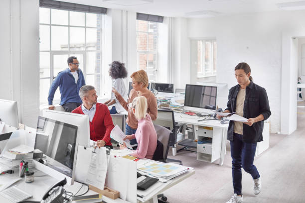 istock Multi-ethnic millennial business people working at office 892974084