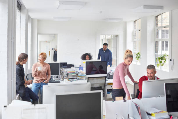 istock Multi-ethnic millennial business people working at office 892974206