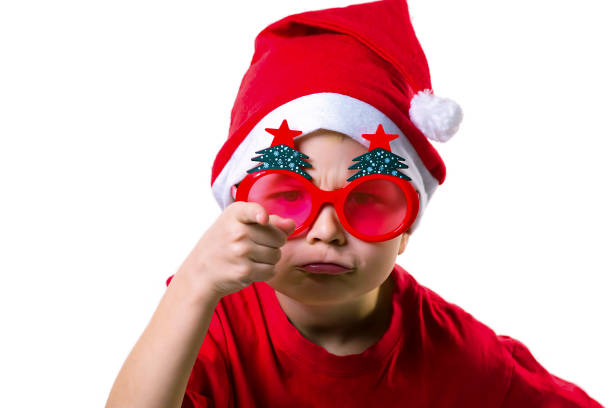 istock boy Santa Claus showing emotions on a white background 892974818