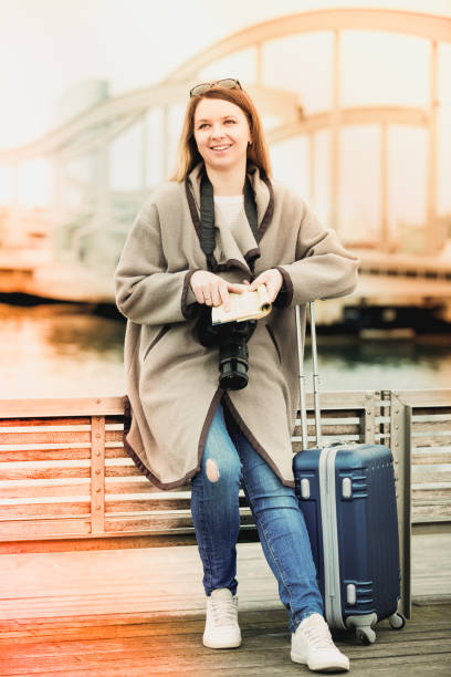 istock Female tourist standing at pier 892979108