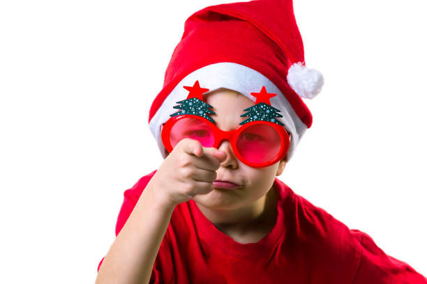 istock boy Santa Claus showing emotions on a white background 892982428