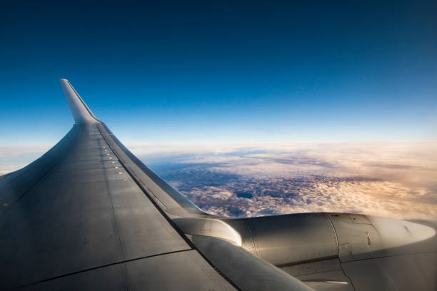 istock View above the clouds from an airplane 892983230
