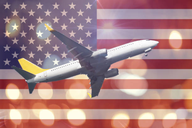 istock american flag with airplane light night bokeh abstract background 892994752