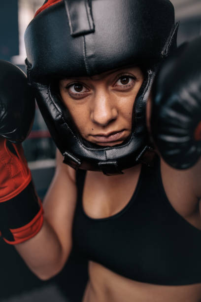 istock Female boxer geared up for a bout 892995912