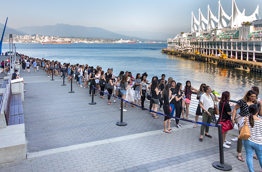 Vancouver: Queue of women waiting around three hours in the line to enter to the Aritzia Warehouse big Sale at Vancouver Convention
