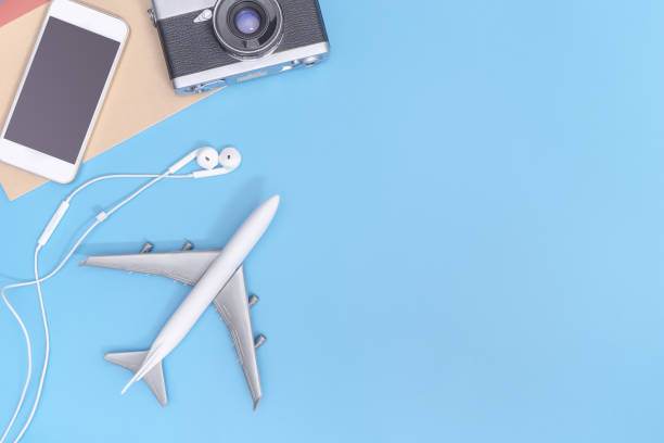 istock Plane and travel objects on blue copy space for poster 893005888
