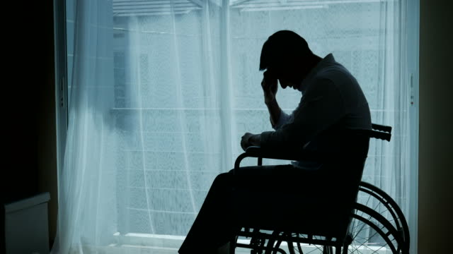 silhouette of business patient man on wheelchair , feel depressed