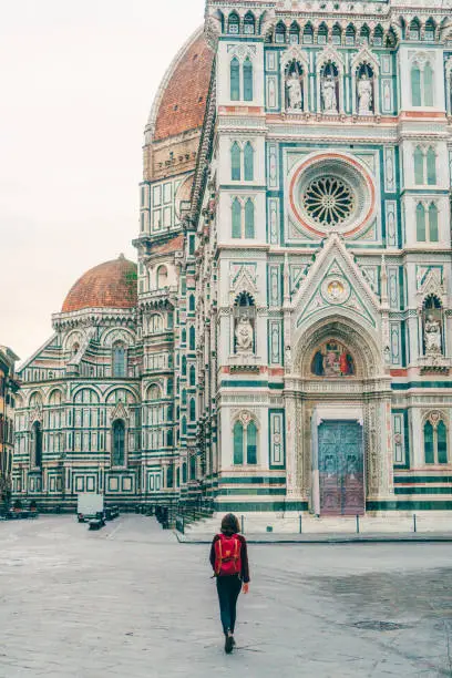 Photo of Woman walking near Duomo Santa Maria del Fiore in Florence