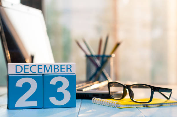 istock December 23rd. Day 23 of month, calendar on student workplace background. Winter time. Empty space for text 893008824