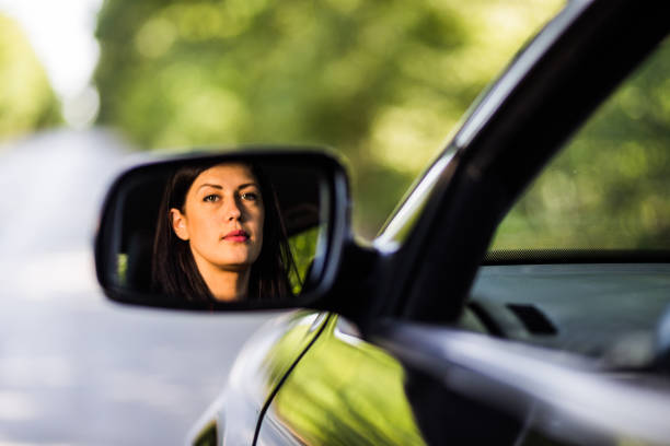 woman ドライバ  - owner women car rear view mirror ストックフォトと画像