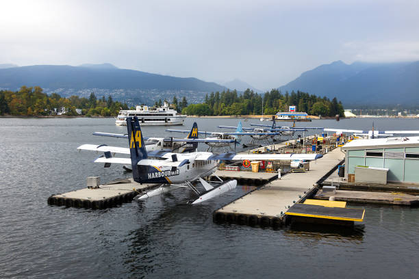 Seaplanes DHC-6 DeHavilland Twin Otter moored in Vancouver. Vancouver: A Seaplane DHC-6 DeHavilland Twin Otter of Harbour Air moored at Vancouver Harbor, Canada. de havilland dhc 6 twin otter stock pictures, royalty-free photos & images